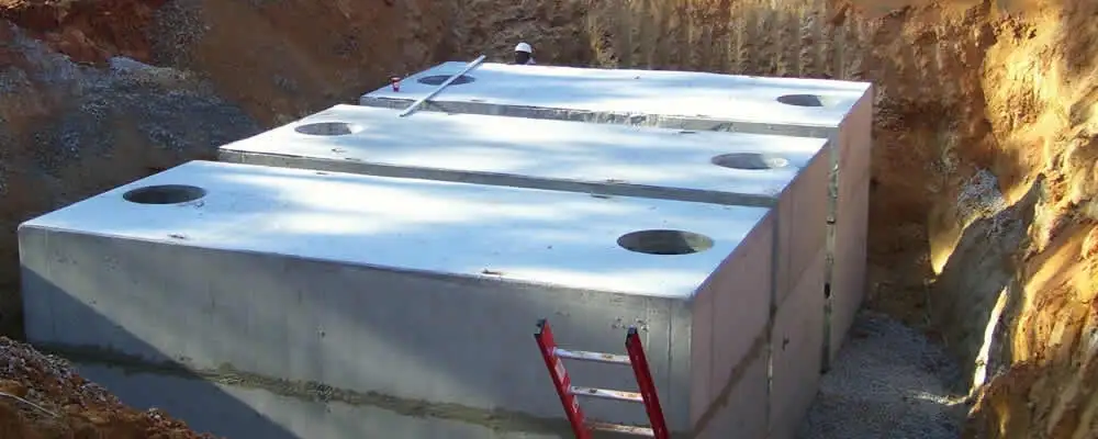 Septic tank installation site with a newly placed concrete tank in Scottsdale, AZ